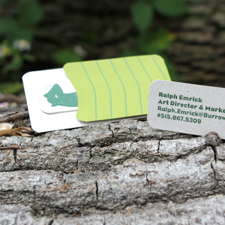burrow business card and business card holder displayed on a log